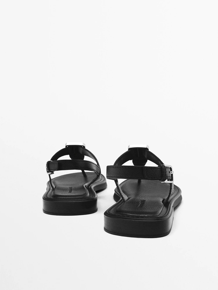 Sandals with metal piece