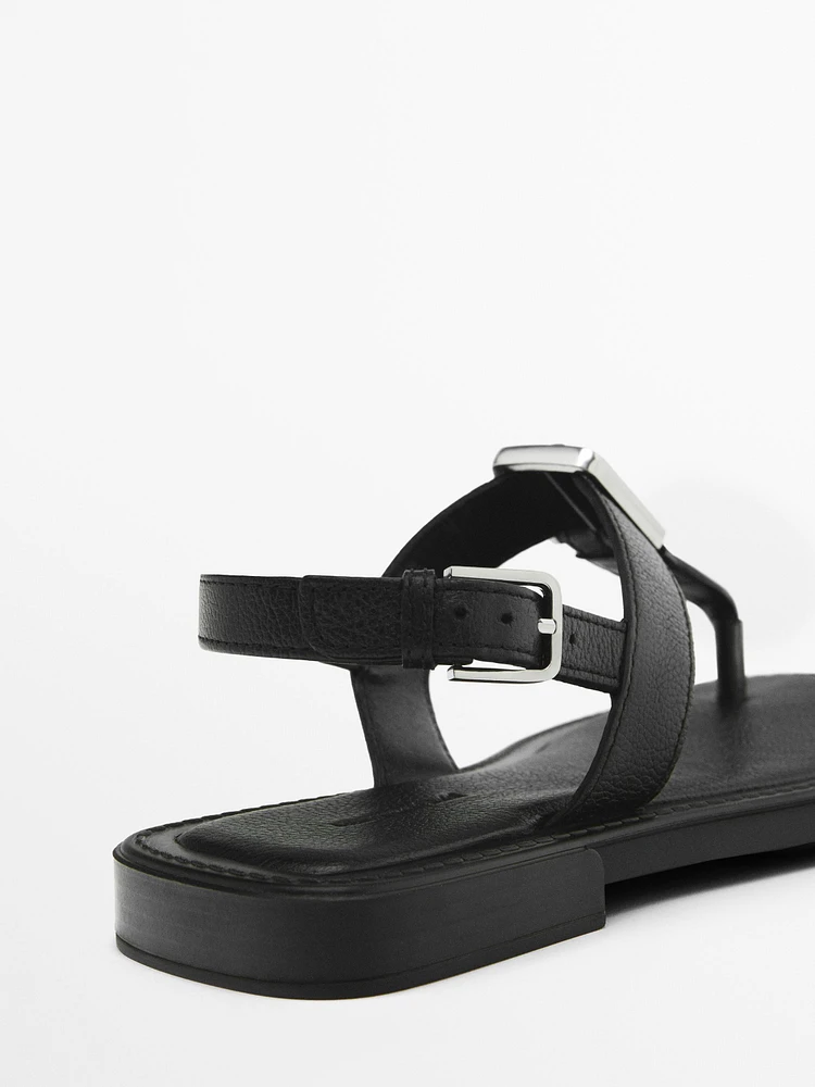 Sandals with metal piece