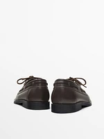 Brown leather deck shoes