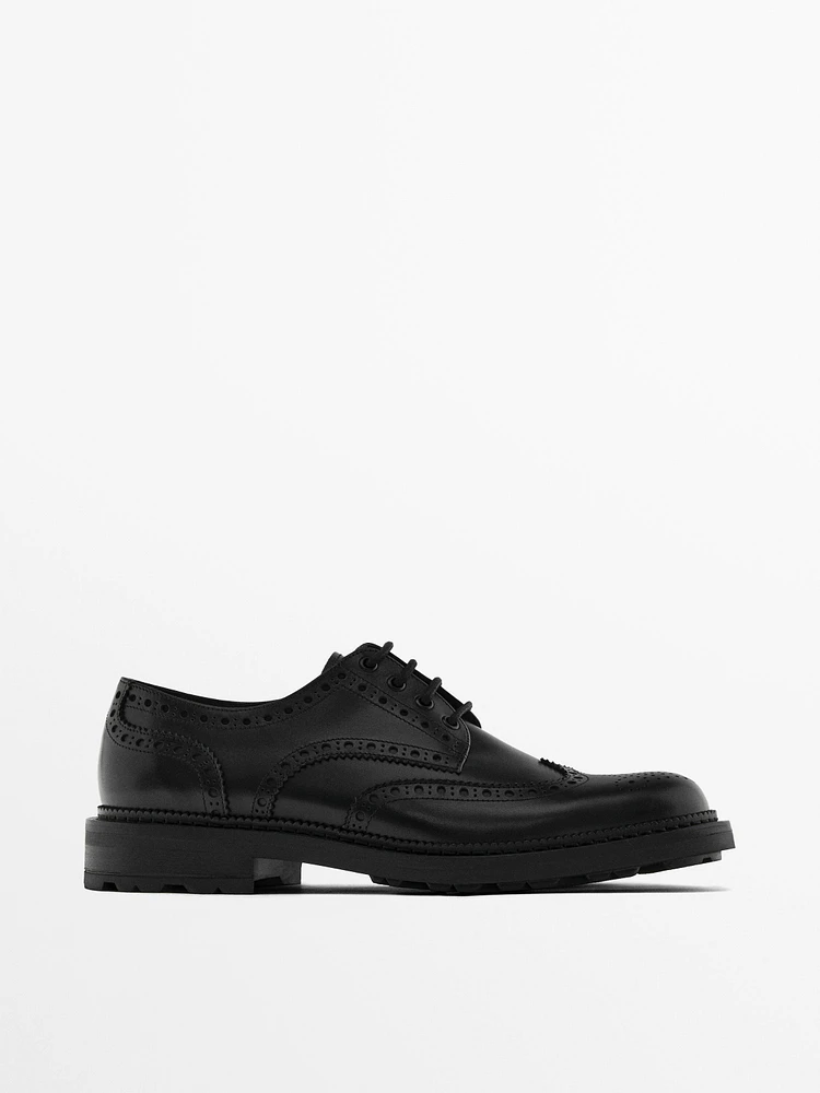 Black leather brogues