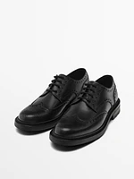 Black leather brogues