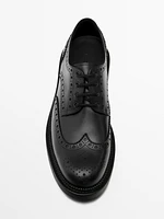 Black leather brogues