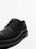 Black leather brogues