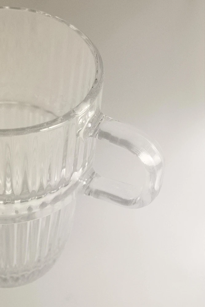 GLASS MUG WITH A RAISED DESIGN