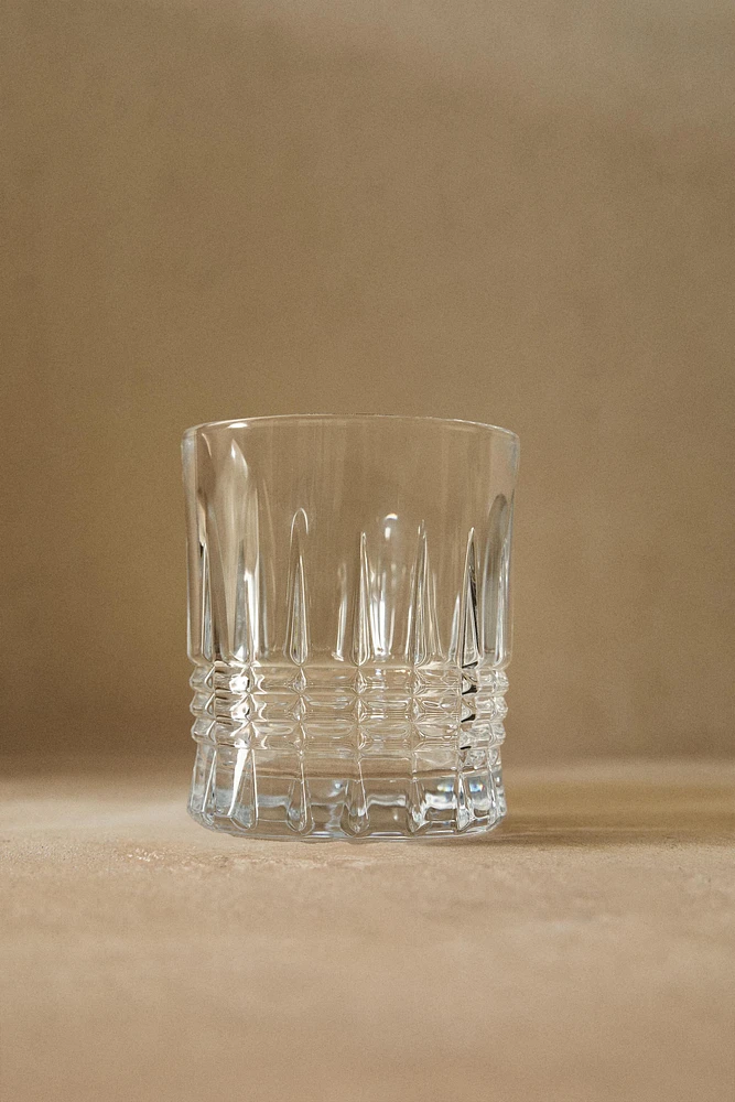 CRYSTALLINE TUMBLER WITH RAISED DESIGN