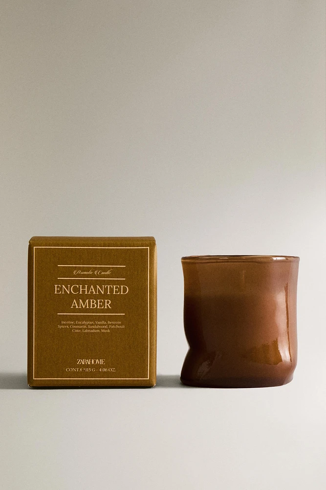 (115 G) ENCHANTED AMBER SCENTED CANDLE