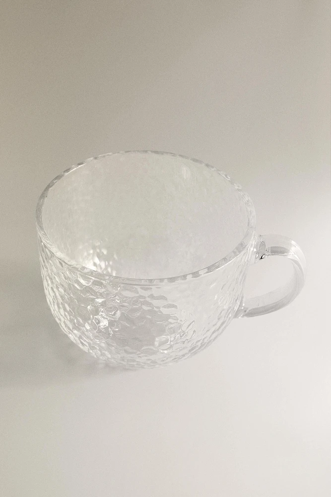 GLASS CUP WITH RAISED DESIGN