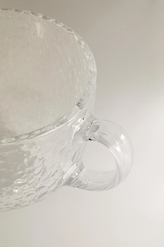 GLASS CUP WITH RAISED DESIGN