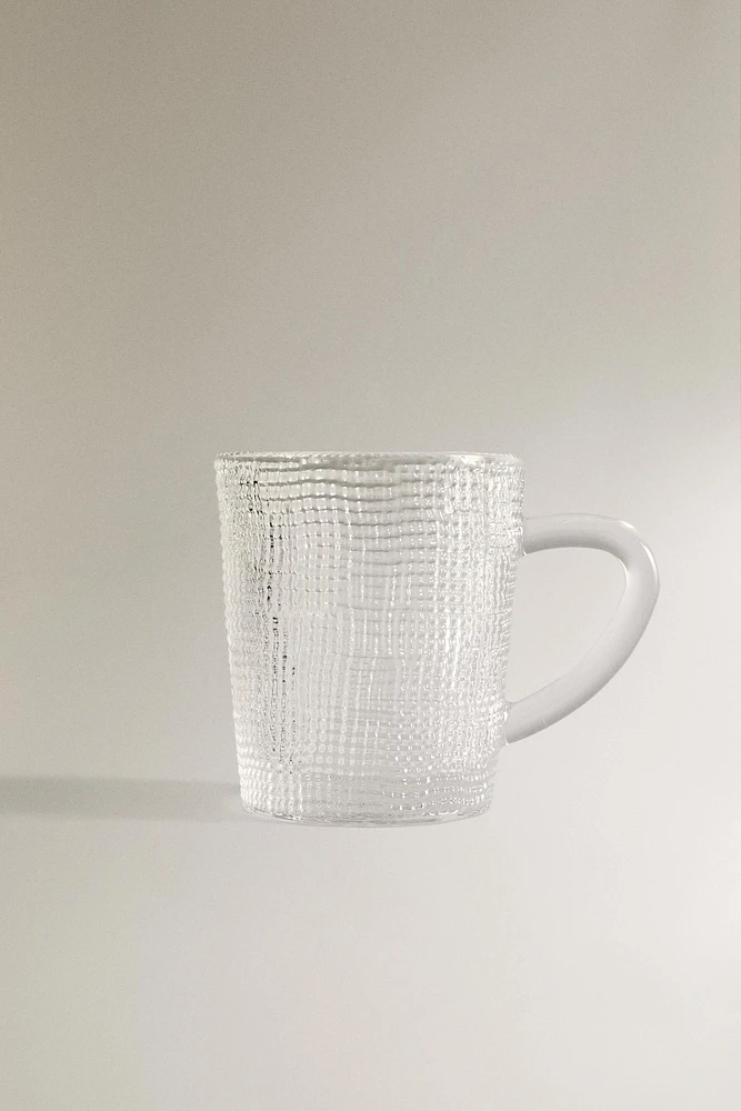 GLASS CUP WITH RAISED DESIGN