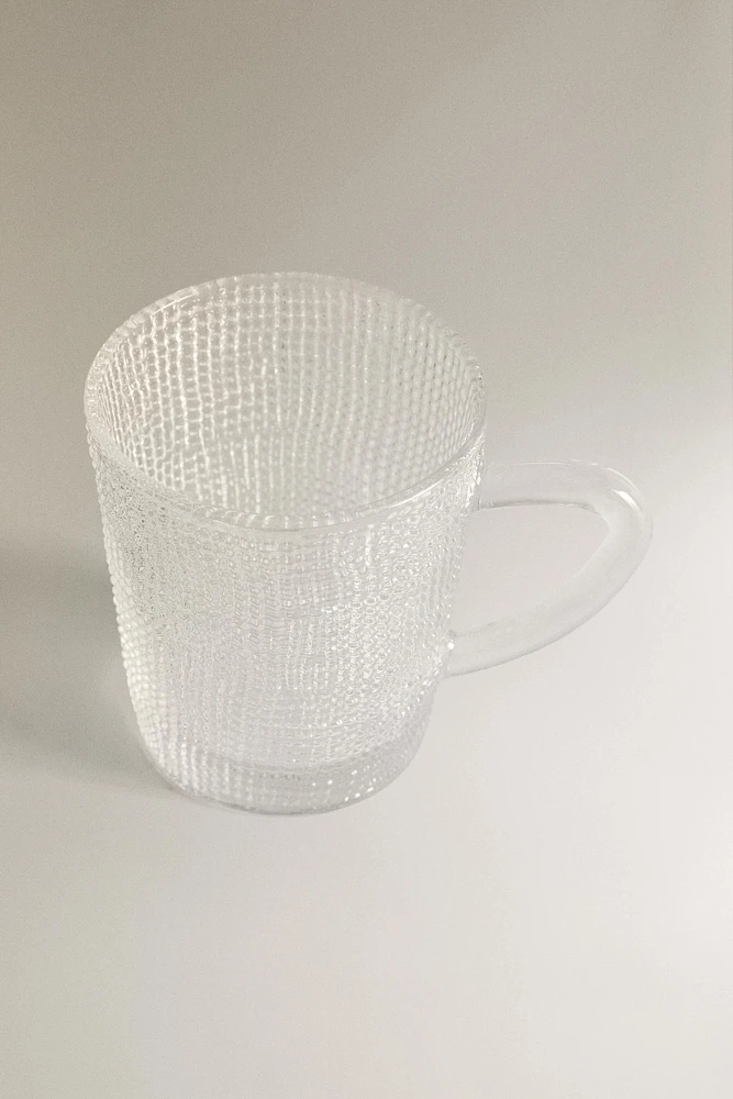 GLASS CUP WITH RAISED DESIGN