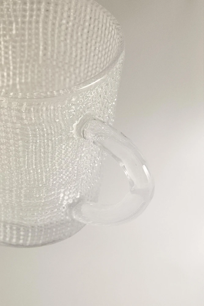 GLASS CUP WITH RAISED DESIGN