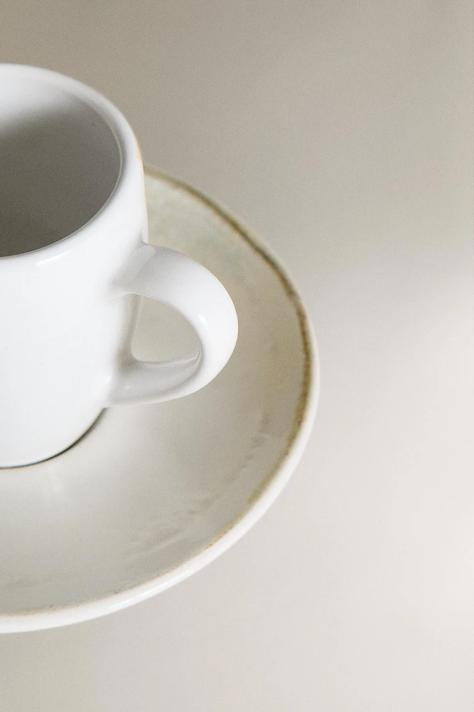 STONEWARE COFFEE CUP AND SAUCER