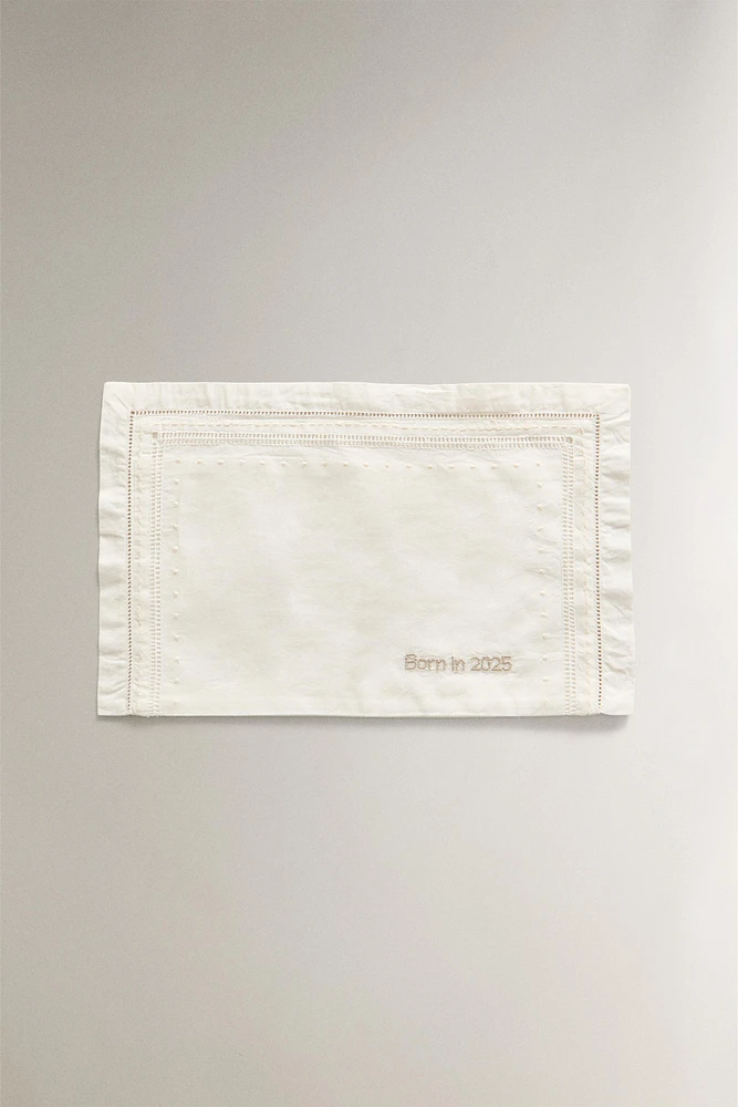 ‘BORN IN 2025’ EMBROIDERED MINI CRIB SHEET SET