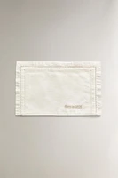 ‘BORN IN 2025’ EMBROIDERED MINI CRIB SHEET SET