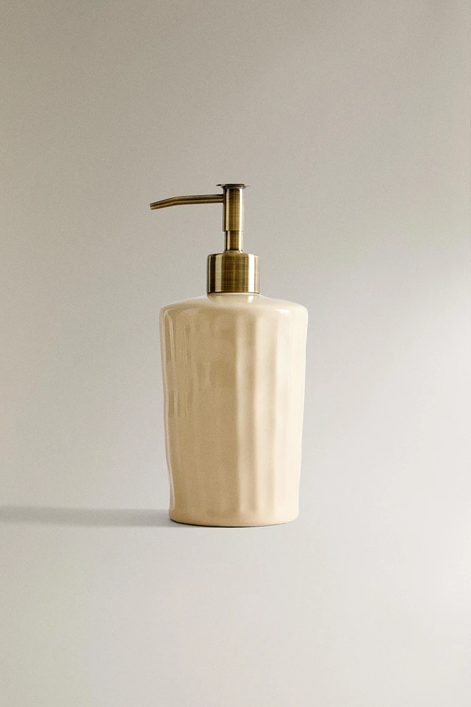 SOAP DISPENSER WITH RAISED DESIGN