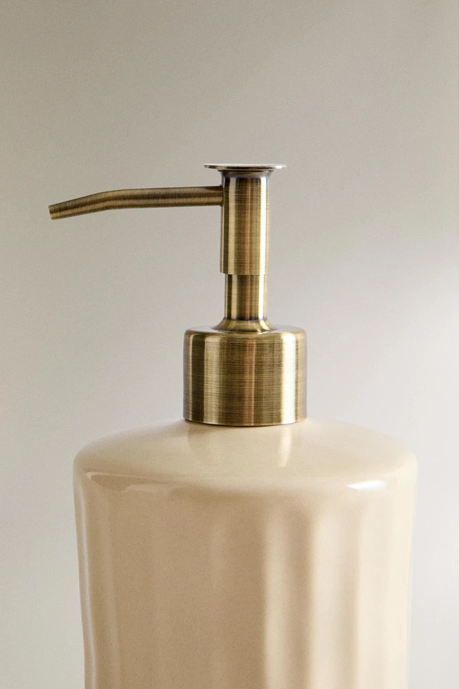 SOAP DISPENSER WITH RAISED DESIGN