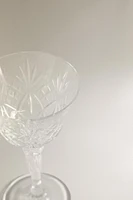 SHOT GLASS WITH A RAISED DESIGN