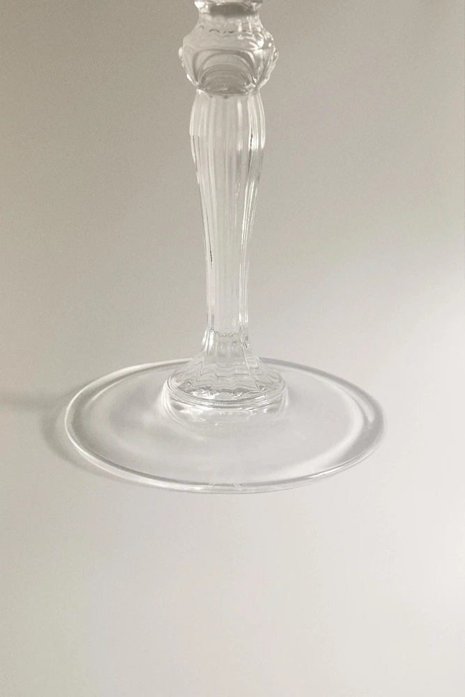 SHOT GLASS WITH A RAISED DESIGN