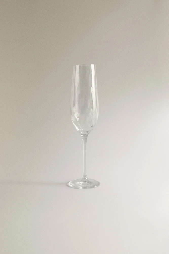 CRYSTALLINE FLUTE GLASS WITH RAISED DESIGN