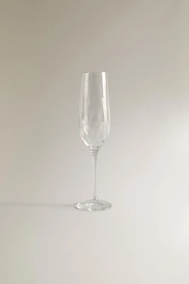 CRYSTALLINE FLUTE GLASS WITH RAISED DESIGN