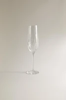 CRYSTALLINE FLUTE GLASS WITH RAISED DESIGN