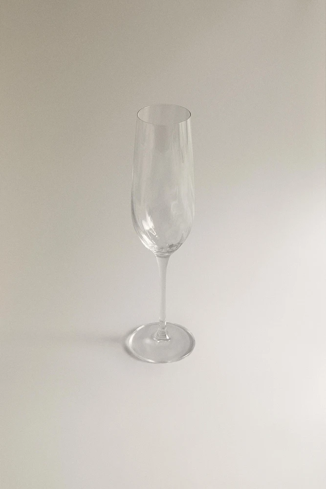 CRYSTALLINE FLUTE GLASS WITH RAISED DESIGN