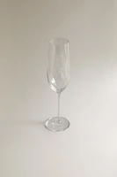 CRYSTALLINE FLUTE GLASS WITH RAISED DESIGN