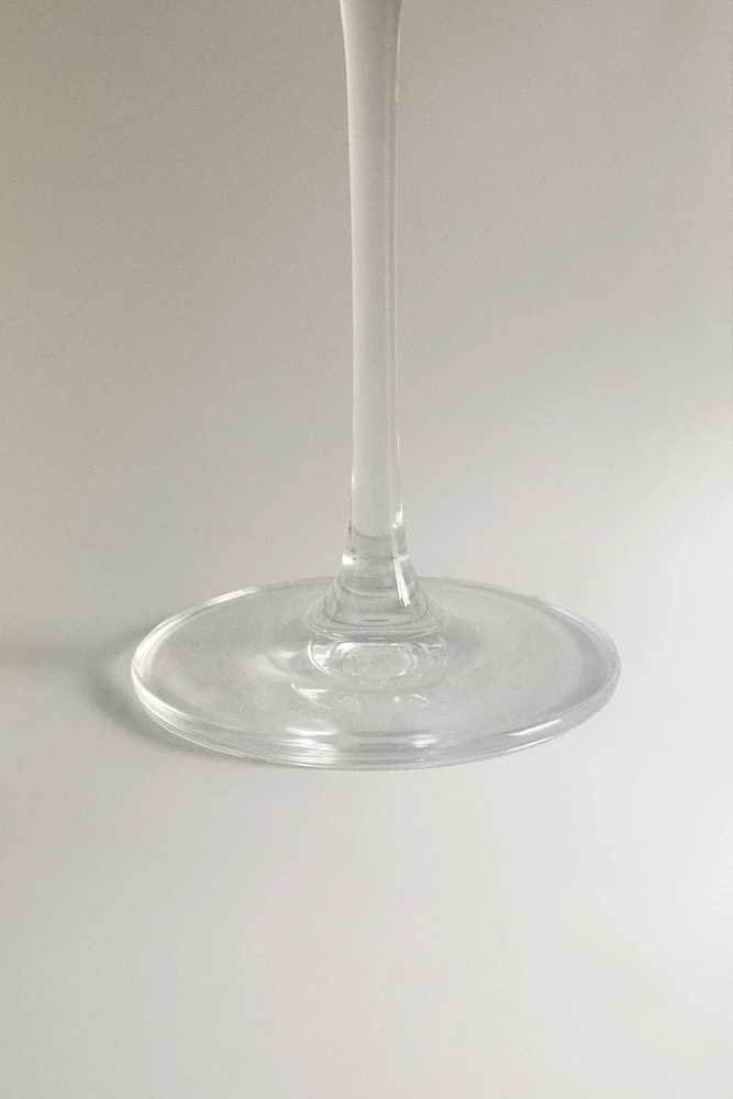 CRYSTALLINE FLUTE GLASS WITH RAISED DESIGN