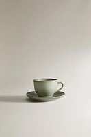 PORCELAIN TEACUP WITH ANTIQUE FINISH RIM