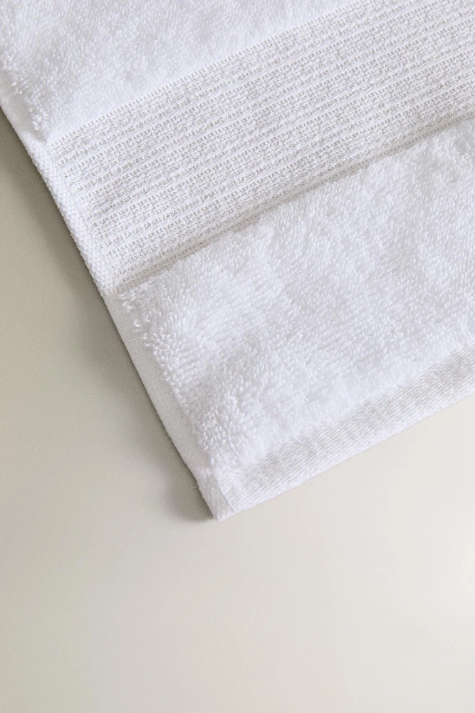 METALLIC THREAD BATH TOWEL WITH BORDER