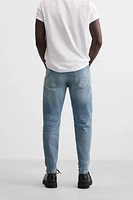 JEANS SKINNY AVEC DÉCHIRURES ET ÉCLABOUSSURES