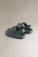 VOLUMINOUS BUCKLED SANDALS