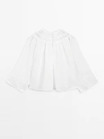 Blouse fluide à dentelle