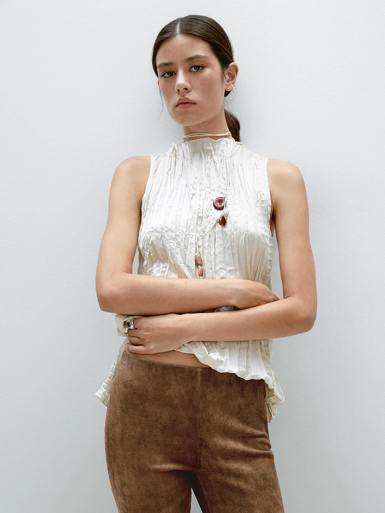 Pantalon flare en cuir finition daim