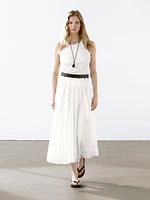 Pleated skirt with leather detail