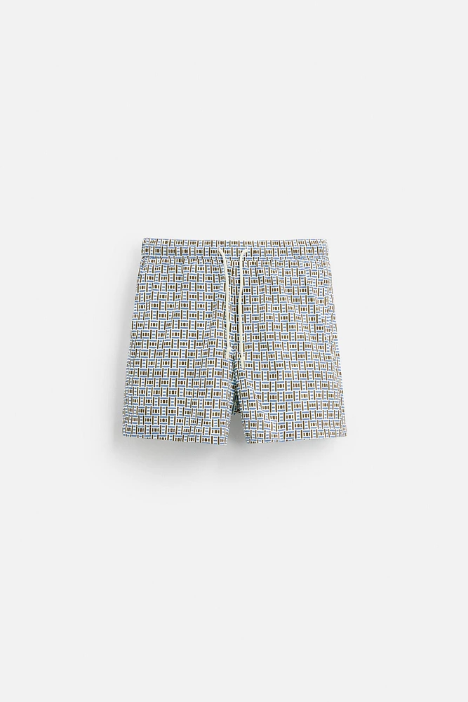 REGULAR FIT GEOMETRIC PRINT SWIM TRUNKS