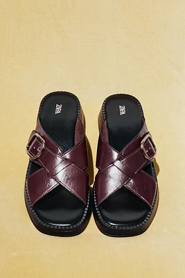 LEATHER CRISS CROSS BUCKLE SANDALS