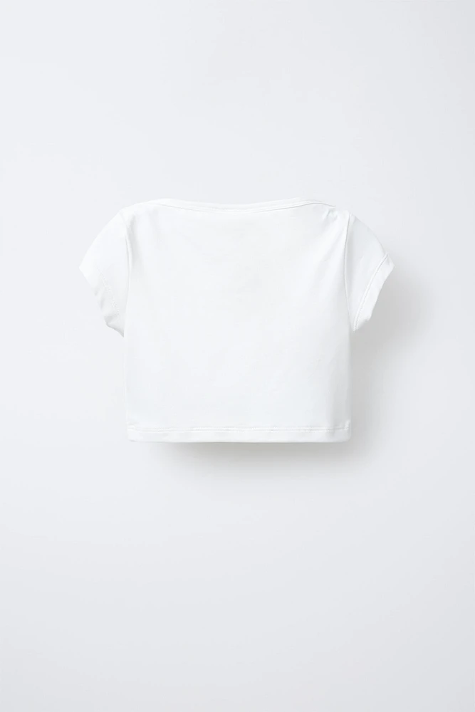 TOP CROPPED UNI ÉLASTIQUE