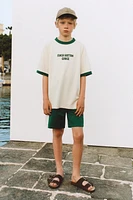 ENSEMBLE DE JOGGING T-SHIRT ET BERMUDA LISERÉS