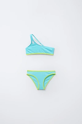 6-14 ANS/ MAILLOT DE BAIN ASYMÉTRIQUE BRILLANT LISERÉS