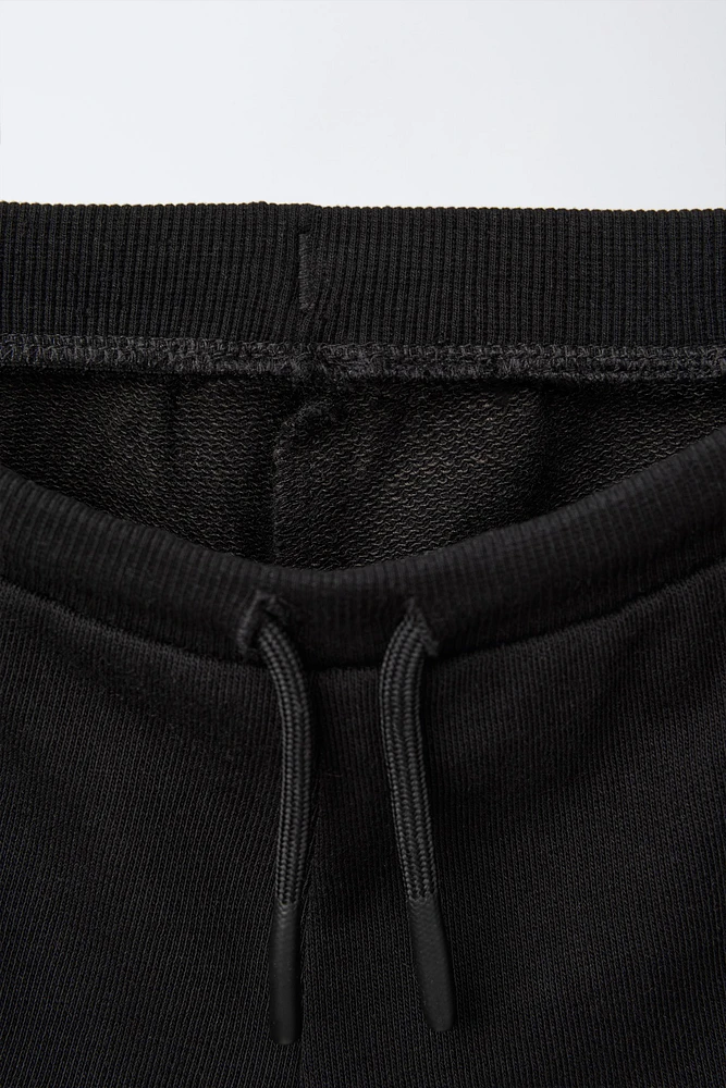 EMBROIDERED PLUSH SHORTS