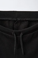 EMBROIDERED PLUSH SHORTS