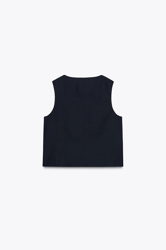 GILET CROISÉ PATTES DE BOUTONNAGE