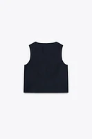 GILET CROISÉ PATTES DE BOUTONNAGE