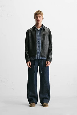 BLOUSON EN MATIÈRE SYNTHÉTIQUE DÉLAVÉE