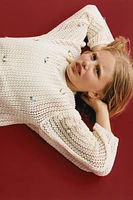 PULL RÉSILLE AVEC FLEURS APPLIQUÉES