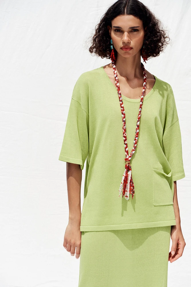 TOP OVERSIZE EN MAILLE MANCHES COURTES