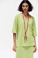 TOP OVERSIZE EN MAILLE MANCHES COURTES
