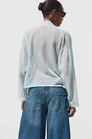 BLOUSE SEMI-TRANSPARENTE EN MAILLE