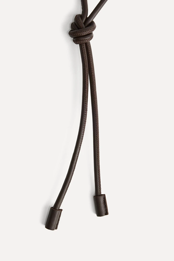 CEINTURE CIRCULAIRE EN CUIR 50E ANNIVERSAIRE
